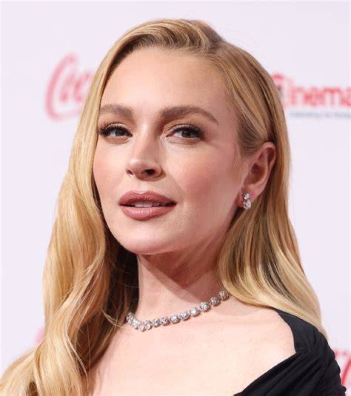 A freshly blonded Lindsay Lohan exits the Andy Lecompte salon in West Hollywood after a mammoth nine-hour appointment