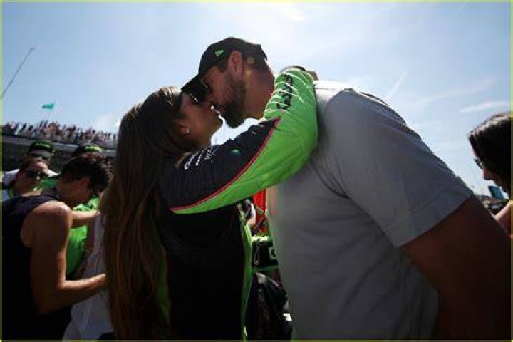 Aaron hugging his girlfriend, Danica