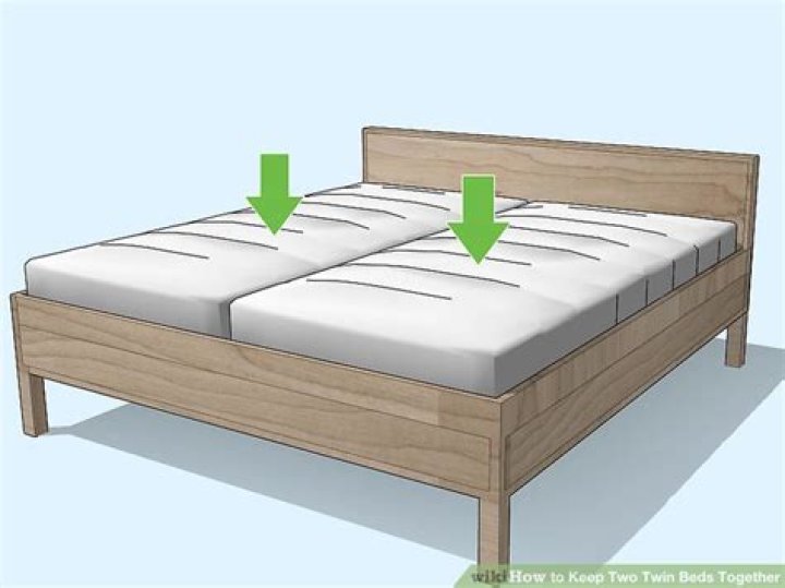 How do you keep two twin beds together?