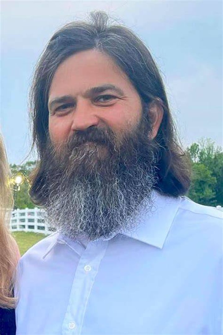 Jep Robertson wearing white T-Shirt and blue pant.