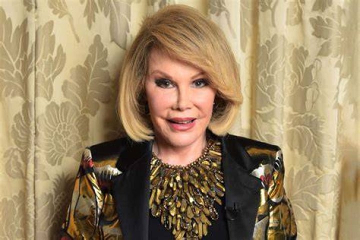 Joan Rivers exits her car