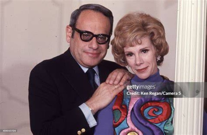 Joan Rivers with a Ken doll
