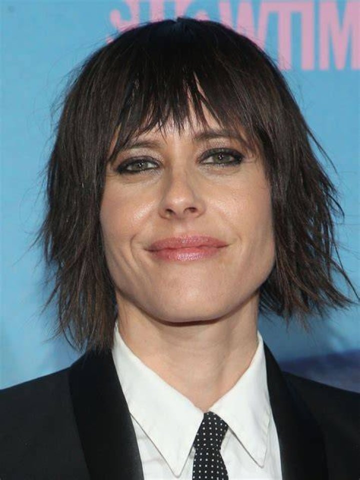 Katherine Moennig's childhood photo while holding a violin.