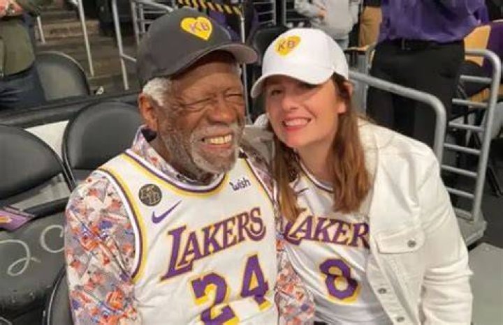 Marilyn Nault's widowed husband, Bill Russell, his fourth wife Jeanine Fiorito, and their dogs.