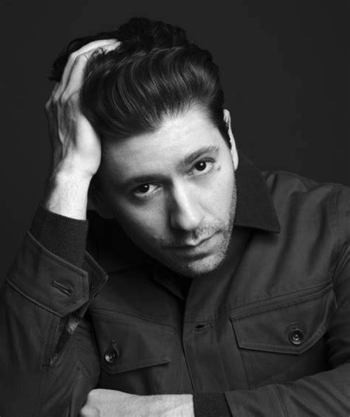 Michael Zegen posing for the camera. earning, income, net worth