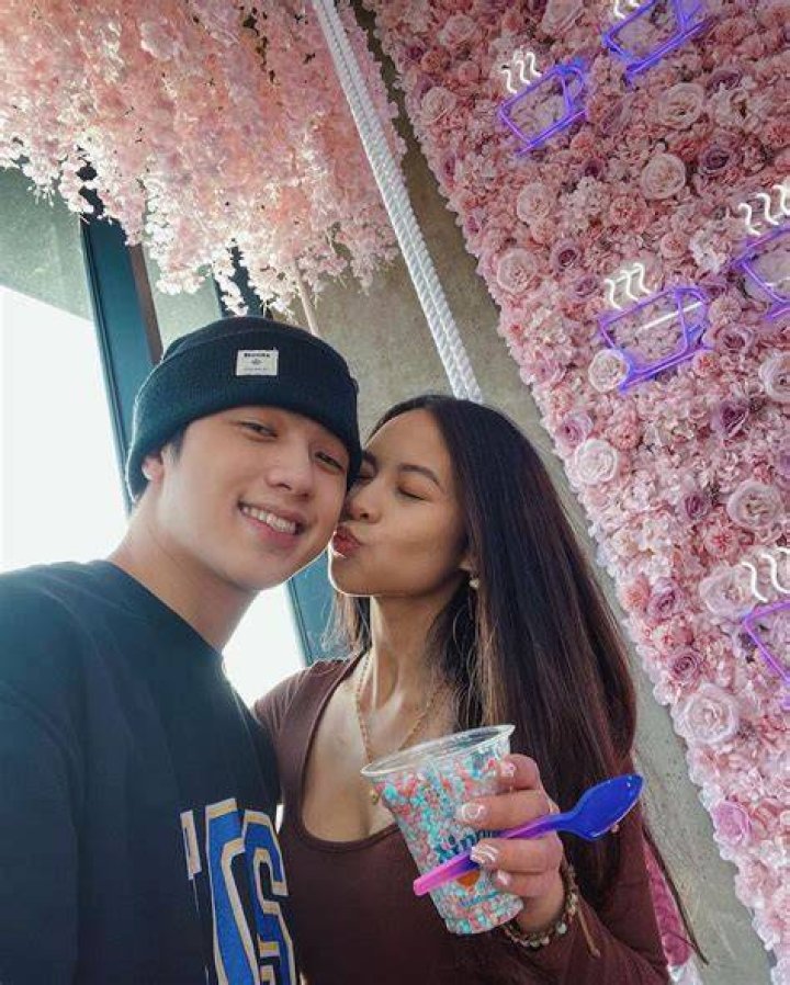 Ranz Kyle (left) being kissed on the cheek by his girlfriend Milissa Grande.