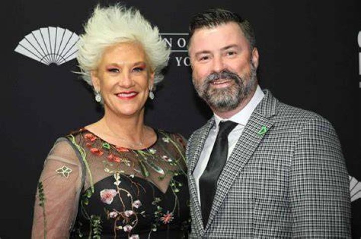 Stuart Claxton began dating Anne Burrell in 2018.